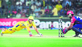 Delhi Daredevils wicketkeeper Naman Ojha (R) runs out Chennai Super Kings Suresh Raina during their match in New Delhi on Tuesday