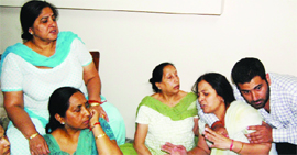 Wailing family members of the deceased in Amritsar on Wednesday.