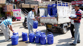 Residents line up to buy potable drinking water in Amritsar.