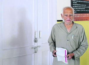 A patient stands dejected at the closed dispensary in Chandigarh on Wednesday.