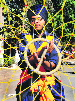 A gatka player exhibits his skills during a procession organised by the Sector 29 gurdwara in Chandigarh on Wednesday.