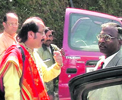 Flutist Ronu Majumdar in a heated discussion with an official of the Lal Bahadur Shastri National Academy of Administration in Mussoorie on Wednesday. 