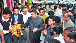 Anand Sharma, Union Minister for Commerce, Industry and Textiles, being received at Kangra
