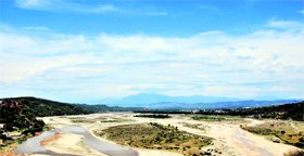 The Tawi meanders its way against the backdrop of a bright sky in Jammu on Wednesday.
