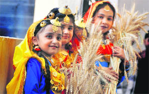 Children all smiles during Baisakhi celebrations at Spring Dale Public School in Ludhiana on Wednesday. 