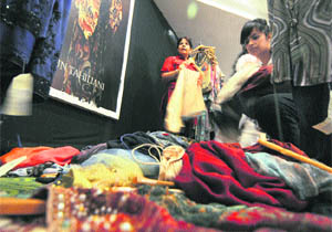 Residents try out new clothes during a fashion sale by Tarun Tahiliani at the Park Plaza in Ludhiana.