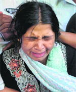 Reshma Bano wails after the death of her daughter Afreen in Bangalore. 