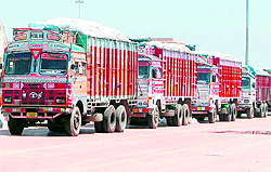 Trucks bound for Pakistan queue up at the entrance of the Integrated Check Post in Attari on Wednesday