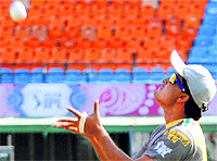 Sourav Ganguly takes a catch at the PCA Stadium in Mohali on Wednesday