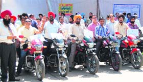 Employees of BSNL hold a motorcycle rally in Amritsar on Thursday