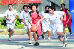 A match in progress during the District Junior Basketball Championship in Dehradun