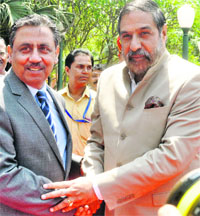 Commerce Minister Anand Sharma with Pakistans Commerce Secretary Zafar Mahmood in New Delhi on Thursday. (Right) Visitors take a look at clothes on display at the Lifestyle Pakistan exhibition. 