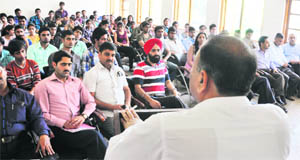 Students take part in a mock test organised at Science College in Jammu on Thursday. 
