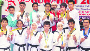 Medal winners of  the tae kwon do team strike a pose. 