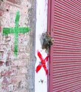 Green and red markings made by the Ludhiana MC staff on a building in Ludhiana. 