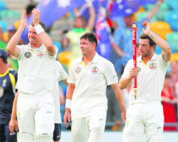 Australias Peter Siddle, Mike Hussey and Matthew Wade acknowledge the applause of their fans after defeating the West Indies in their first Test. 