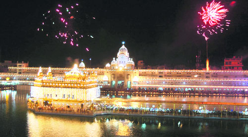Fireworks add dash to the illuminated Golden Temple on Baisakhi in Amritsar on Friday. 