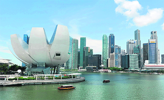 The financial business district in Singapore. The wealthy Southeast Asian island nation avoided a technical recession as data released on Friday showed the economy grew by almost 10 per cent in the first quarter of 2012, recovering from a slump in the previous three months.
