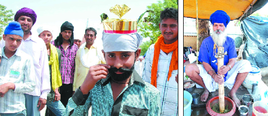 A man twirls his fake moustache while another (right) grinds a herb to paste at the Baisakhi Mela held at Talwandi Sabo on Friday. 