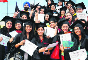 Students of the GGDSD College pose with their degrees at the convocation held on the college campus in Sector 32, Chandigarh, on Friday. 