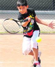 A player returns a shot during a match in the Manav Mangal Total Tennis Tournament in Phase X, Mohali, on Friday.