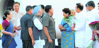Prime Minister Manmohan Singh being welcomed by Mayor Raj Bala Malik while UPA chairperson Sonia Gandhi (extreme left) looks on at the Chandigarh airport on Friday.