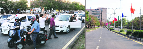 Vehicles stuck in a traffic jam at the Sectors 11 and 5 roundabout; and (right) the internal road of Sector 5 in Panchkula wears a deserted look due to Prime Minister Manmohan Singh’s visit to Panchkula on Friday.