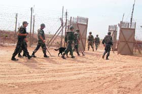 BSF jawans on duty near a gate on the international border in Jammu