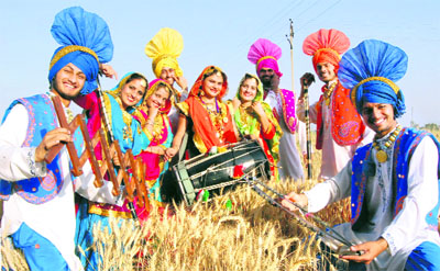 Students of Lovely Professional University celebrate Baisakhi in a wheat field in Jalandhar on Thursday