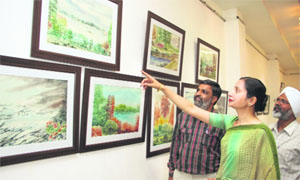 Artists exhibit their works at an exhibition held at Virsa Vihar in Jalandhar on Friday.