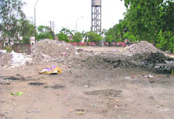Garbage littered at sites for booths and shop-cum-offices of a commercial pocket on the Jail Road in Ludhiana