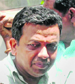 Prof Ambikesh Mohapatra being prodced in a court in Kolkata on Friday. 