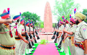 A contingent of the Punjab Police pays tributes to martyrs of the Jallianwala Bagh massacre in Amritsar on Friday.