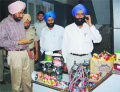 Health Department officials show the seized tobacco and hookahs from a restaurent in Amritsar