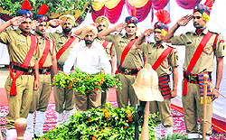 An MC official lays wreath on the occasion of fire service day at the fire station at Sector 17 in Chandigarh on Saturday