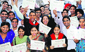 Students pose with their degrees at the convocation of Government Postgraduate College, Sector 11, Chandigarh, on Saturday