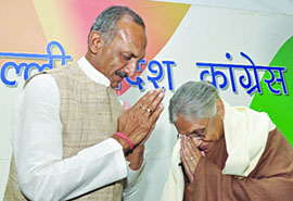 Chief Minister Sheila Dikshit and DPCC president and MP Jai Prakash Agarwal greet each other at a press conference on the eve of MCD elections in New Delhi on Saturday.