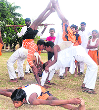 Gurukul School students do asanas on the 105th foundation day of the school in Haridwar on Saturday
