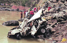 The vehicle which met with an accident on Friday being pulled out of the Chenab in Ramban 
