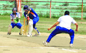A batsman plays a defensive stroke during a match in the Baisakhi Premier League T20 Cricket Tournament at MA Stadium in Jammu on Saturday. 