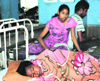 Pita Singh along with his sister and brother at the orthopaedic ward of the Civil Hospital in Jalandhar
