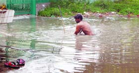 An MC employee clears the blocked sewerage in Amritsar