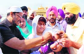 Industry Minister Anil Joshi kicks off the Pulse Polio drive at the Golden Temple in Amritsar on Sunday