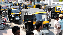 Protesting against loss of business following the launch of city bus service, auto-rickshaw drivers park their vehicle outside the house of MLA Sarup Chand Singla at Aggarwal Colony in Bathinda on Sunday