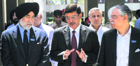 Rakesh Singh, Chief Secretary, Punjab (centre), talks to Analjit Singh, chairman of Max Group (right), and Sunilkant Munjal during his visit to the Indian School of Business, Mohali, on Sunday. Tribune photo: Vicky Gharu