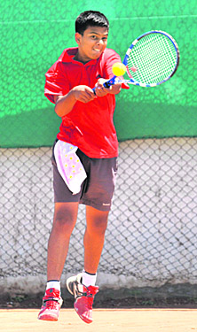 A player in action during the Manav Mangal Total Tennis Championship at Phase X, Mohali, on Sunday. 