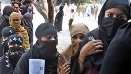 Muslim women at a polling booth.
