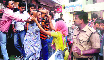 The weeping mother of an eight-year-old child who died due to negligence in a nursing home at Jwalapur in Haridwar on Sunday.