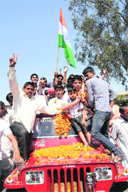 Boxer Sumit Sangwan being welcomed by relatives and supporters in Karnal on Sunday after he was qualified for the London Olympics.