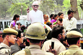 The police tries to control a brawl between two social groups over installing Anna Hazares statue in Gurgaon on Sunday.